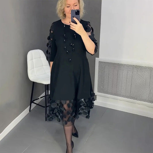 Elenora | Elegante zwarte midi- jurk  met stippen